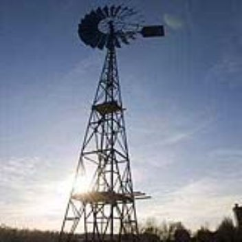 A windmill which pumps and uses an osmosis membrane