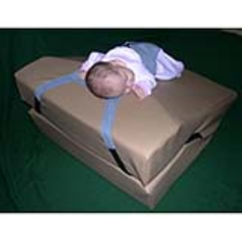 Vinyl-covered foam wedge used for the management of infant reflux