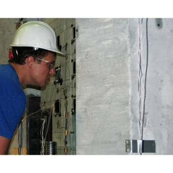 Grant Schmitz eyes a section of a concrete column