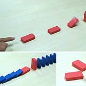 Wireless dominoes fall without contact