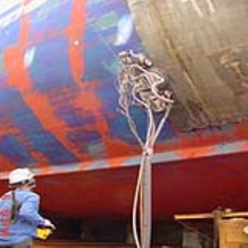 Robot uses high pressure water jets for ship coating removal