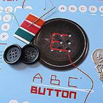 Nine hole buttons for creating the alphabet