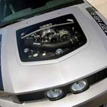 Car hood with a transparent window which lets you see the engine