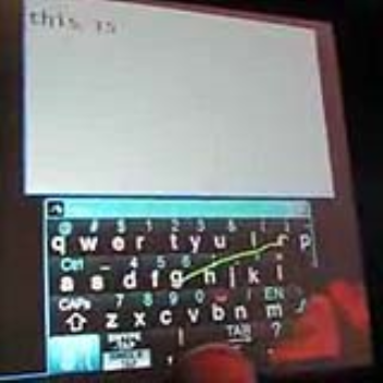 An on-screen keyboard which works by sliding from one letter to the next