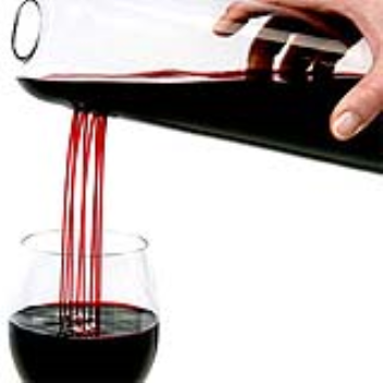 Wine decanter pours wine through 8 holes