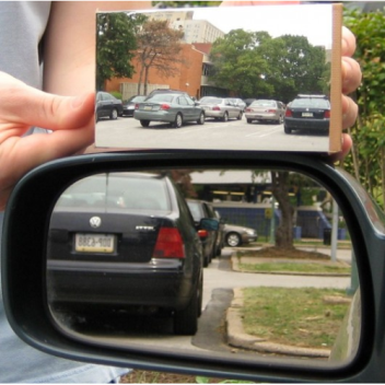 Dr. Hicks' mirror (top) as compared to a regular flat driver's side mirror